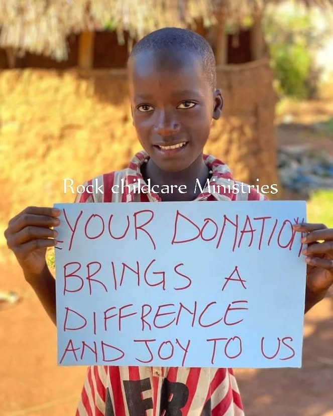 Child holding sign about donation impact
