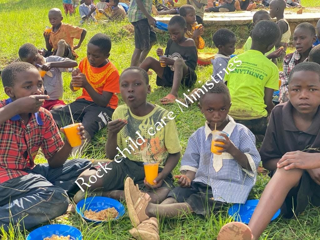 Children eating on grass