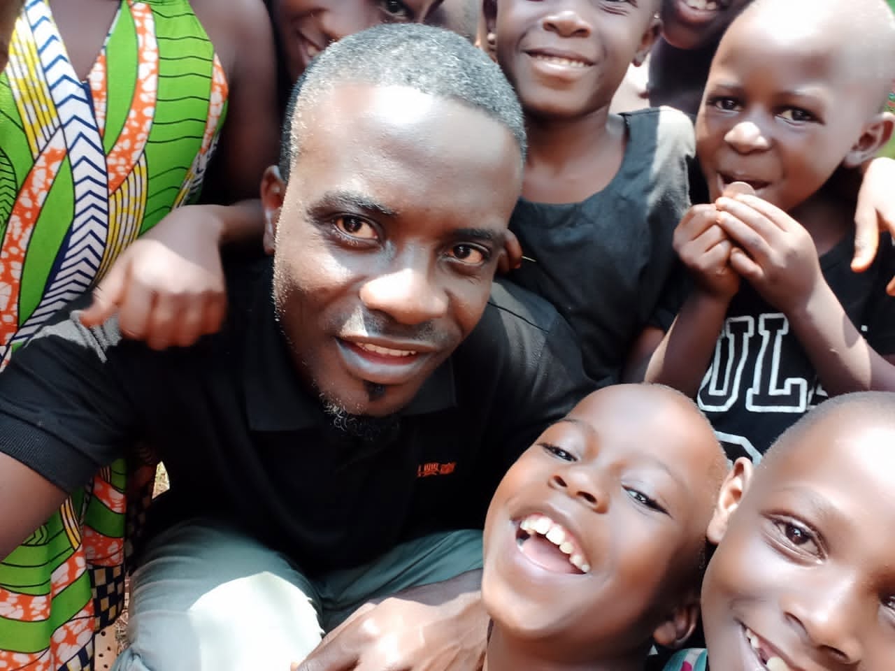 Children and community members smiling together